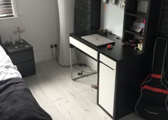 Loft oak laminate flooring in bedroom